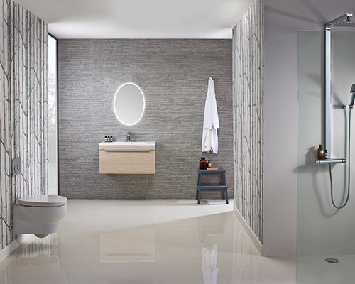 A grey minimalist bathroom, with sink, toilet and shower